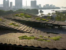 kengo kuma guangzhou astilleros rio perla arquitectura moderna piedra volcánica